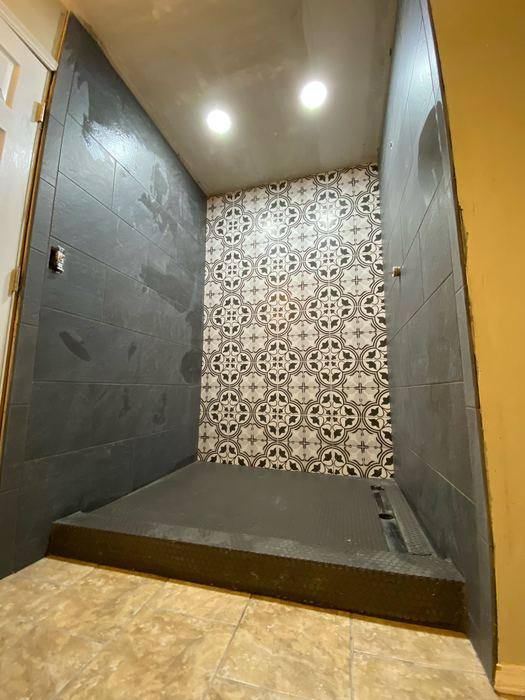 Patterned tile shower accent wall